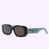 Christian Dior CD40032U 5355E WILDIOR S2U women’s sunglasses feature black marbled rectangular frames, dark lenses, and light blue arms with embossed CHRISTIAN DIOR PARIS logo. Lexor Miami is an authorized Dior Sunglasses dealer.