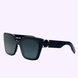 The Christian Dior SUNGLASSES LADY 95.22 S2I CD40148I 30B1 feature dark blue square frames, geometric arm detailing, and gradient dark lenses, displayed on light purple. Available from your Miami authorized Dior Sunglasses dealer.