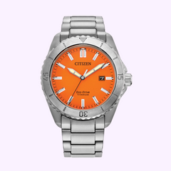 The Citizen Watches AW1840-50X Brycen, featuring Eco-Drive technology, an orange dial, silver markers, date at 3 o’clock, and a metal bracelet, is shown on a light purple background. Brand: Citizen Watches. UPC: 013205165979.