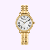 A gold-tone Citizen Watches EM1052-51A Classic Coin Edge women’s watch (UPC: 013205157547) with a white face, black Roman numerals, and metal link band is shown against a light purple background displaying the time as 1:49.