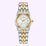A Citizen Watches Eco-Drive Corso EW2299-50A women’s watch by Citizen Watches, featuring a two-tone silver and gold stainless steel band, white dial with gold markers and hands, date display at 3 o’clock, and a gold crown, showcased on a light background.