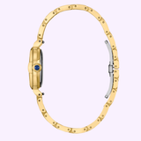 The Citizen Watches L Mae EM1133-85L Limited Edition, a slim gold ladies’ wristwatch by Citizen Watches, is displayed from the side to showcase its thin case, distinctive blue crown, and open bracelet clasp—all set against a light purple background.
