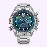 The Citizen Watches Promaster Navihawk A-T AT8220-55W features a stainless steel case, blue and green detailed dial with subdials, rotating bezel, luminous hands, linked metal band, and Eco-Drive technology.