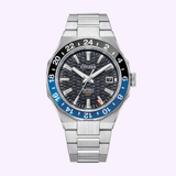 Citizen Watches Series8 880 GMT NB6031-56E: stainless steel watch with black and blue GMT bezel, textured black dial, date at 3 o’clock, and silver links on a light purple background.