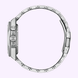 Side view of the Citizen Watches Series8 890 City Lights NB6060-58H with a silver metal band and case buttons, shown on a light purple background.