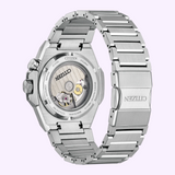 A silver Citizen Watches Series8 890 NB6060-58L is shown from the back, revealing its exposed mechanical movement and engraved details on the stainless steel case and bracelet.