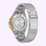 A Citizen Watches Series8 NB6084-50A is shown from the back, displaying its automatic movement through a transparent case back. The metal bracelet and clasp enhance its sport-luxury look.