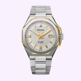 The Citizen Watches Series8 NB6084-50A features a silver and gold-tone stainless steel band, textured white dial, date at 3 o’clock, and geometric bezel, displayed against a light purple background.