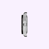 Side view of the Tissot Watches PR516 Powermatic 80 T1494071105100, a silver Swiss automatic watch with a round crown, shown against a light purple background.