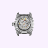 A close-up of the TISSOT Watches PR516 Powermatic 80 (T1494071105100) showcases its exposed Swiss automatic movement and inner mechanics through the transparent case back.