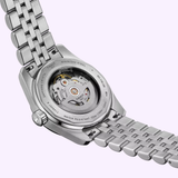 The Tissot Watches PR516 Powermatic 80 (T1494071105100) displays its transparent case back, showcasing the Swiss automatic movement, stainless steel bracelet, and engraved edge text.