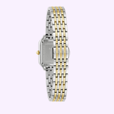 The Bulova Watches Sutton 98L330 women’s two-tone watch features a silver and gold stainless steel bracelet, shown from the back to highlight the clasp and bracelet links on a light purple background.
