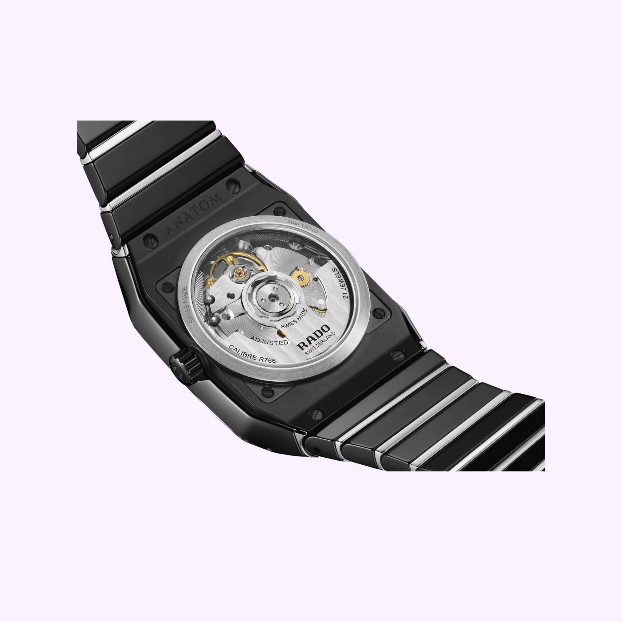 A close-up of the Rado Anatom Automatic Men Watches R10201152 by Rado Watches, showing its high-tech ceramic glossy black bracelet and case, plus a transparent back that displays the intricate inner mechanical movement.