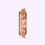 A side view of the Tissot Watches PR516 Quartz Chronograph T1494173305100 in rose gold, featuring two round pushers and a textured crown, set against a light purple background, reflecting Tissot Watches' elegant style.