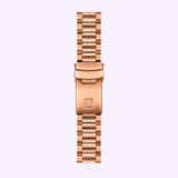 The Tissot Watches PR516 Quartz Chronograph T1494173305100 features a rose gold metal band with rectangular links, a folding clasp engraved with a T, and is displayed against a light pastel background.