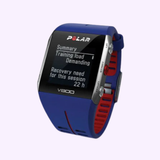 The blue Polar 90050556 V800 Fitness Watch w/ Heart Rate Monitor by Polar Watches shows a training summary with ‘Training load: Demanding’ and ‘Recovery need: 22 h’, featuring silver side buttons and a red inner strap.
