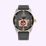 The Citizen Watches AW1794-47W Mickey Mouse Club features a retro TV dial with Mickey Mouse, black leather strap, gold-tone accents, red details, and a date window at 3 o’clock—a playful tribute to the Mickey Mouse Club.