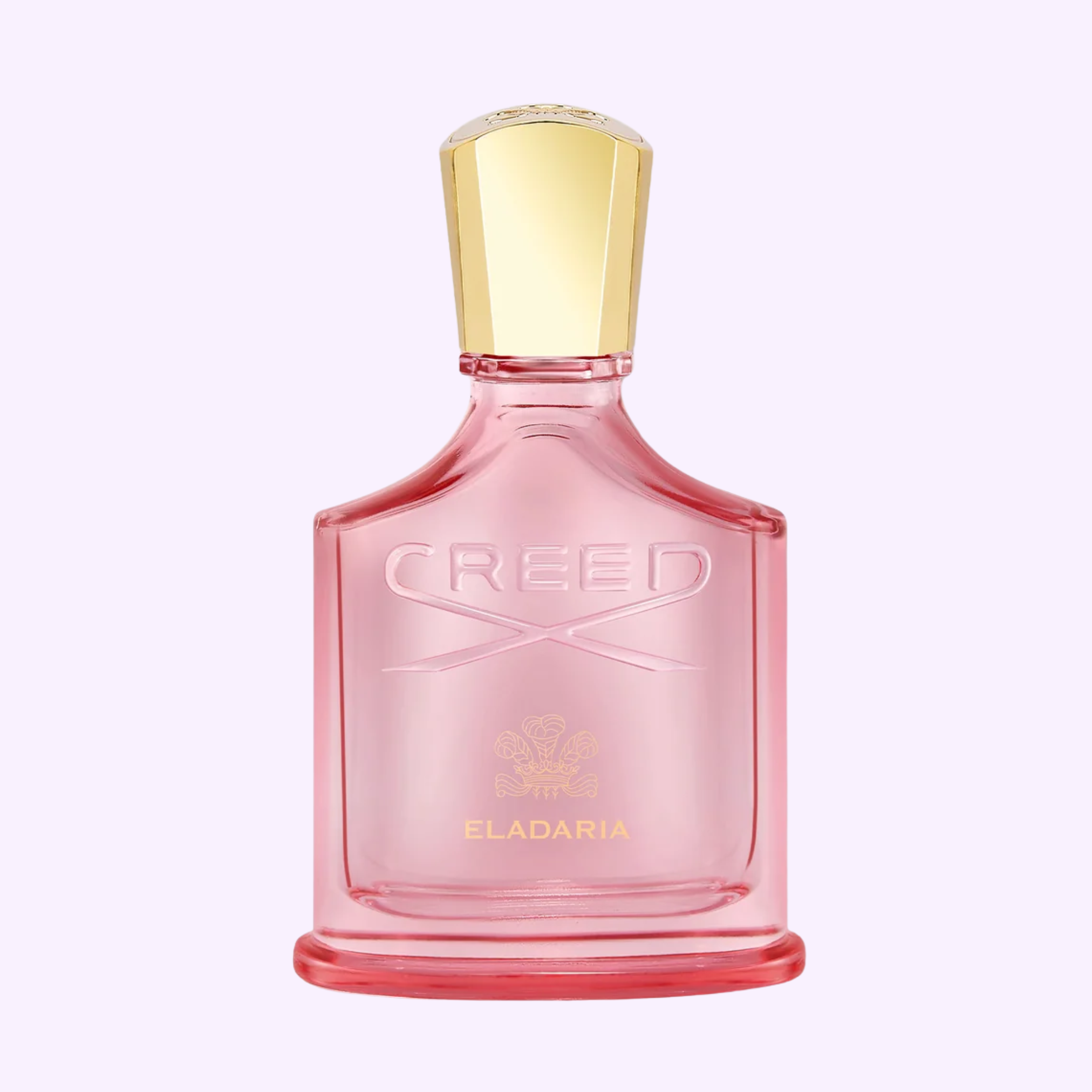 A pink glass bottle of Creed Love In Eladaria 2.5 EDP Sp Women Parfum by Creed Perfumes, adorned with a gold cap, gold lettering, and an embossed logo, is set against a pale lavender background—perfectly capturing the essence of modern femininity and the captivating allure of this luxury floral fragrance.