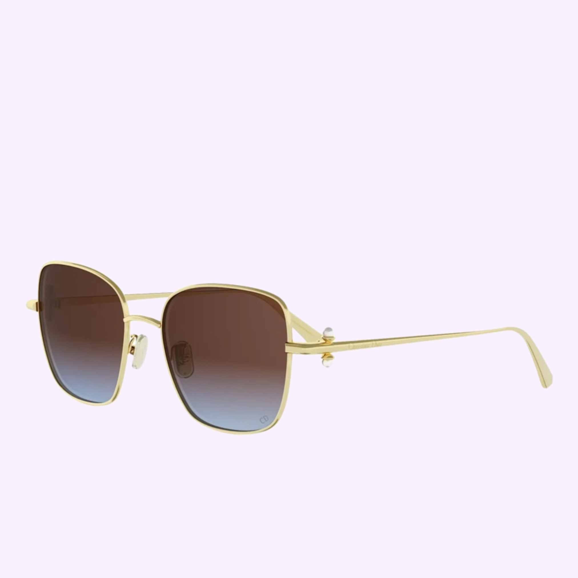 Dior Sunglasses DIORTRIBALES S1U CD40234U 5510T feature gold frames, square brown gradient lenses, and thin arms—ideal for sunny Miami days—shown on a light purple background.