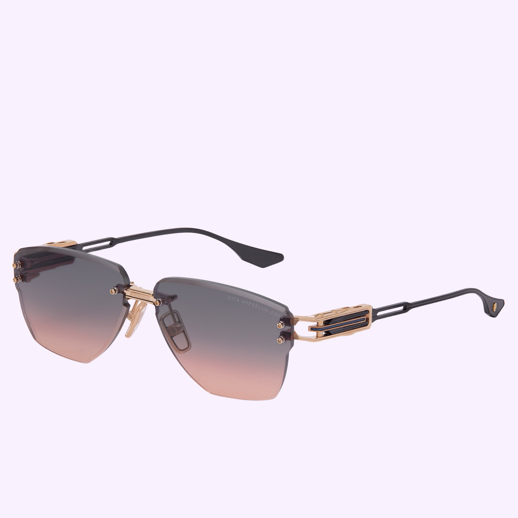 Dita Sunglasses HYPERLUX-2000 DTS197-A-03 feature gradient brown lenses, a gold-accented bridged frame, and black arms with detailed gold and black temples, shown on a light purple background.