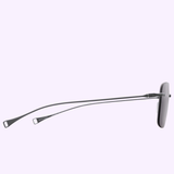 Side view of the Dita Sunglasses LSA-119 DLS119-A-03RO by Dita Sunglasses, featuring modern titanium frames with thin metal arms and rectangular lenses, displayed against a light purple background.