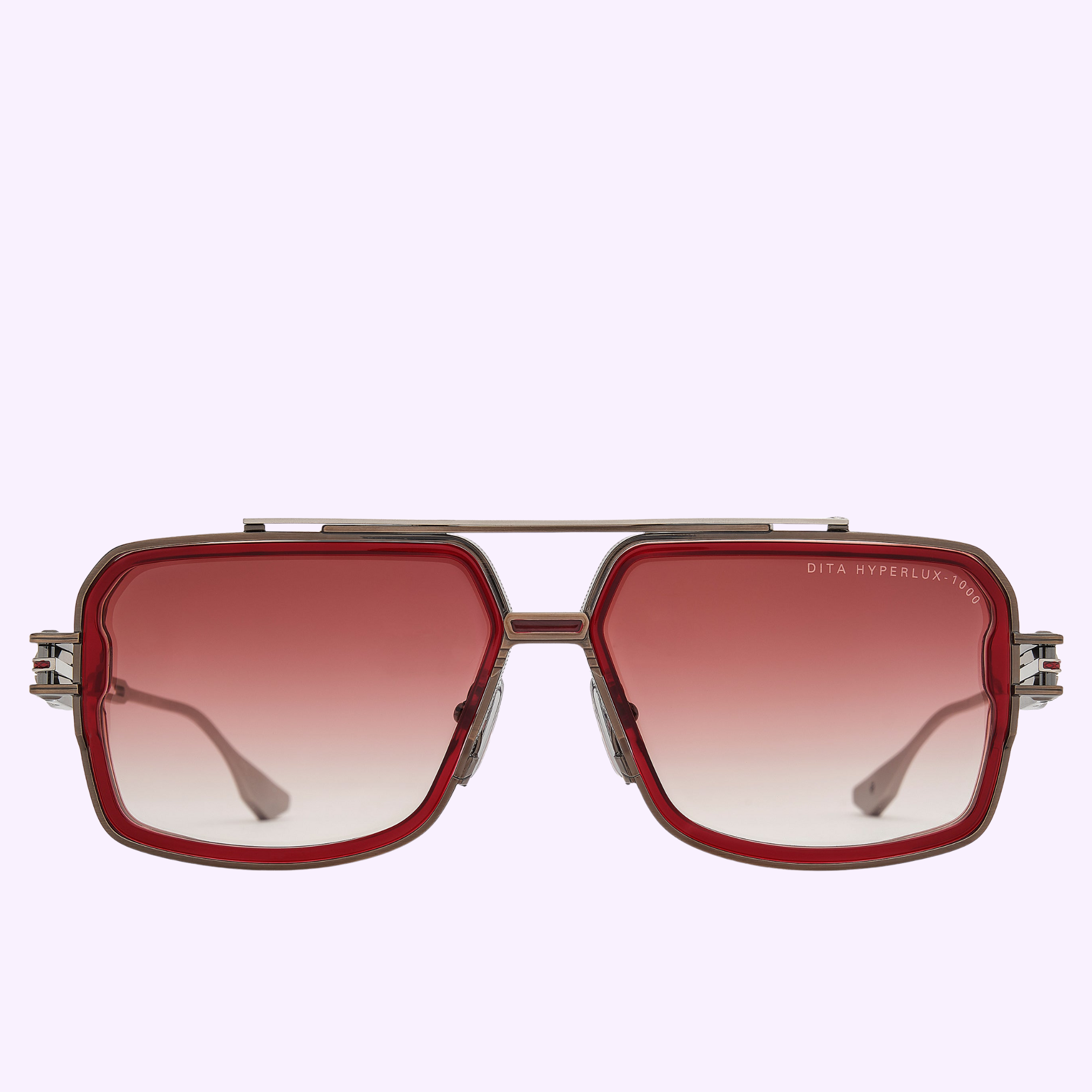 The Dita Sunglasses HYPERLUX-1000 DTS470-A-03 feature a square aviator navigator silhouette, thin Japanese titanium frame, red gradient lenses, double bridge design, and DITA HYPERLUX branding on the lens, shown on a light lavender background.