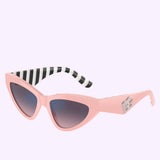 Discover authentic standout style with the Dolce&Gabbana 0DG4439 3098H9 Pink Women’s Sunglasses. Featuring a chic pink cat-eye frame, gradient lenses, bold black and white striped inner arms, and a metallic DG logo on the side, these Dolce&Gabbana Sunglasses are set against a light purple background—perfect for making a statement.