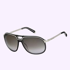 Discover the Dsquared DQ0061 05B 60 Women Sunglasses by Dsquared Sunglasses, showcasing classic aviator styling with black frames, sleek silver arms, and gradient dark lenses—beautifully displayed on a light purple background.