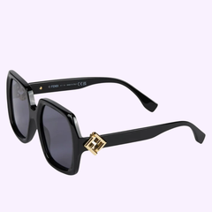 Fendi Sunglasses FE40139I 5301V for women feature a black square-frame, dark lenses, and gold Fendi logo on the temples, shown against a plain light background. Brand: Fendi Sunglasses.