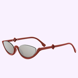Fendi Sunglasses FE40178U 66G: red cat-eye frames with mirrored lenses, unique angular arms, and FF Diamonds accents by Fendi Sunglasses, shown on a light lavender background.