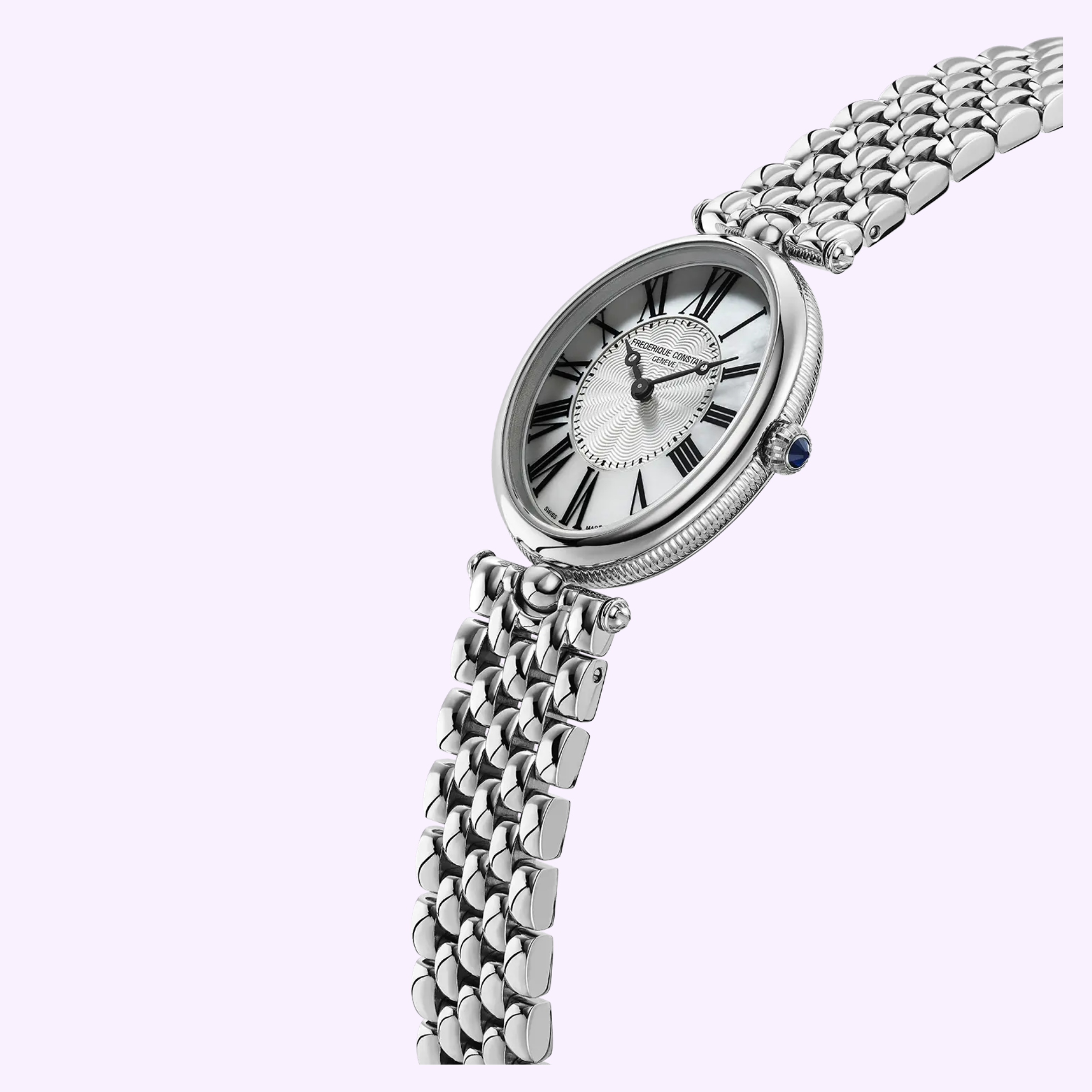 The Frederique Constant Classics Art Deco Oval FC-200MPW2V6B watch, featuring a silver metal link band, white face, black Roman numerals, and ornate black hands, is displayed at an angle on a light lavender background.