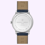 The Frederique Constant Watches Classics Moneta Moonphase FC-206N3S6 is shown from the back, revealing engraved text with the brand name, serial number, and other details. Its elegant brown and blue leather strap stands out against a light background. This unisex luxury watch showcases Frederique Constant’s Swiss craftsmanship at its finest.