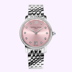 The Frederique Constant Watches Classics Slimline Ladies FC-220LPD1SD26B features a pink dial, diamond hour markers and bezel, a date window at 6 o’clock, and a silver link bracelet, shown on a light purple background.