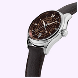 A Frederique Constant Classics Runabout FC-350RBR5B6 automatic wristwatch with a silver case, brown textured dial featuring a 24-hour ring, and a dark brown leather strap.