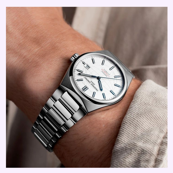 Frederique Constant FC-303S3NH26B Highlife Automatic COSC watch with silver globe-motif dial and integrated stainless steel bracelet