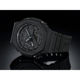 The G-Shock GA2100-1A1 2100 Series wristwatch (UPC: 889232241630) by G-Shock Watches is displayed at an angle against a black background, showcasing its analog-digital display, shock-resistant build, rugged design, and durable band.