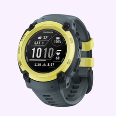 The Garmin Watches Instinct® E – 40 mm 010-02932-01 features a round black display, grey and Electric Lime bezel, grey strap with yellow accents, and shows time, date, weather, heart rate, and steps.