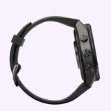 Side view of a black Garmin Watches fēnix® 9 Pro – 43mm (010-04335-15) GPS smartwatch by Garmin Watches, featuring three round buttons on the right side, a black wristband, and an AMOLED display, set against a light purple background.
