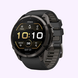 Black Garmin Watches fēnix® 9 Pro – 51 mm 010-04337-15 smartwatch with a circular digital display showing the time, date, and fitness metrics, featuring a textured silicone band.