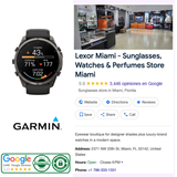A black Garmin Watches fēnix® 9 Pro – 51 mm 010-04337-15 sports watch with a digital display showing health metrics, next to retail store information including its name, address, Google reviews rating, and contact buttons.