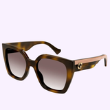 Gucci GG1300S-003 55 women's sunglasses in tortoiseshell with thick square frames, gold logo on the arms, and gradient lenses displayed on white with GUCCI and LEXOR MIAMI logos above and below.