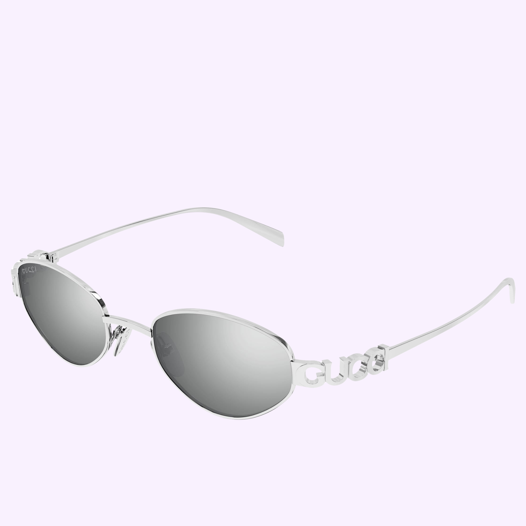 The Gucci Sunglasses GG1935S-004 47 feature silver frames and oval mirrored lenses, with thin metal arms displaying the GUCCI logo near the hinges, set against a pale lavender backdrop for a luxurious touch.