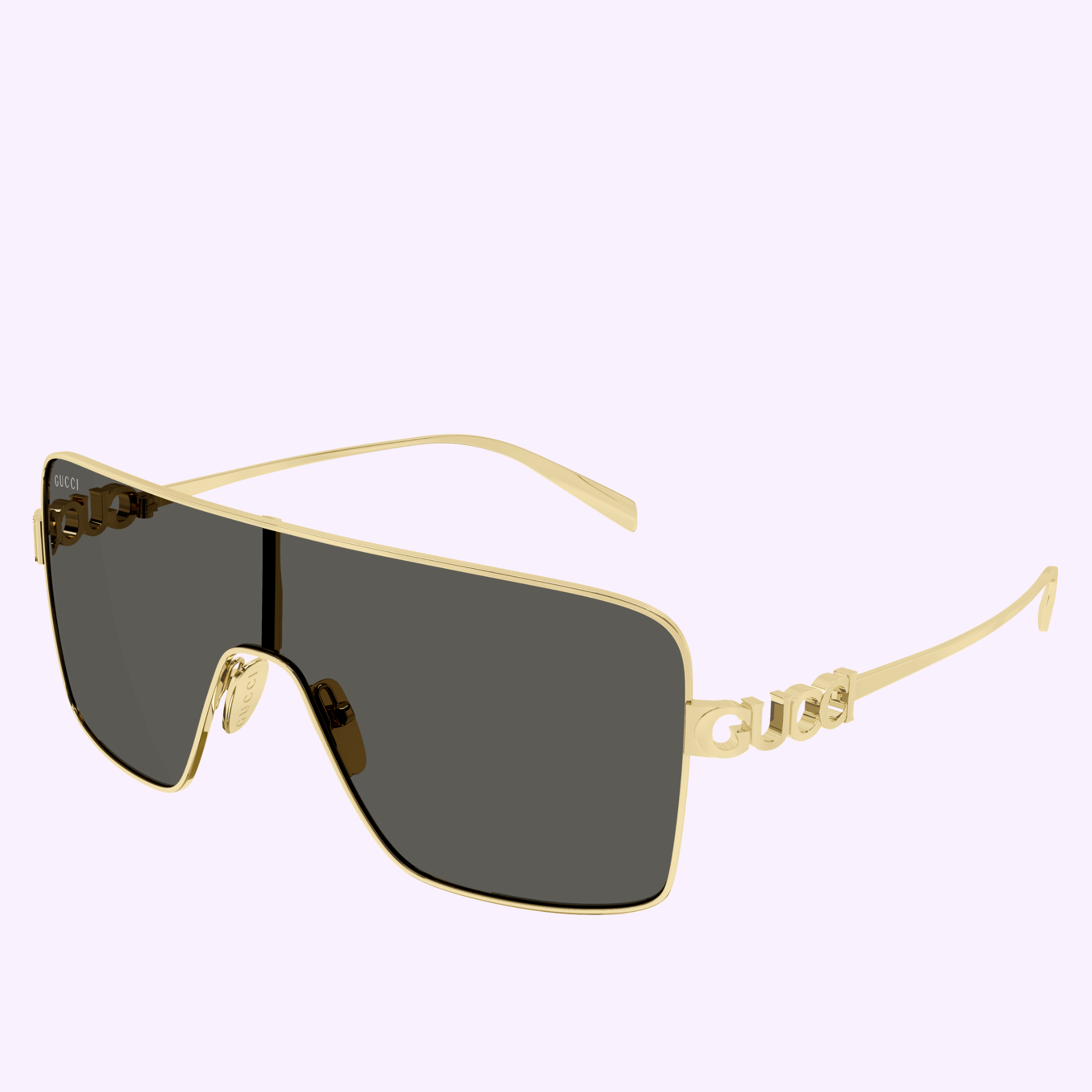 Gucci Sunglasses GG1936S-001 99 feature gold rims, a single dark rectangular lens, and thin metal arms with the Gucci logo near the hinges—an elegant contemporary accessory against a light background.