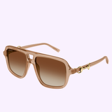 The Gucci Sunglasses GG2052S-010 55 feature square lenses, gold accents on the arms, and a translucent beige frame, all set against a pale lavender background—making them the ideal statement piece for luxury fashion enthusiasts. This model showcases the classic sophistication that defines Gucci Sunglasses.