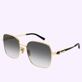 Gold-framed square Gucci Sunglasses GG2053S-001 58, featuring dark gradient lenses and black ear tips, are displayed against a light purple background—these Gucci sunglasses offer a perfect statement piece for contemporary and luxury fashion enthusiasts alike.