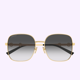 Gucci Sunglasses GG2053S-001 58 are showcased on a light purple background, featuring gold-rimmed square frames, dark gradient lenses, black temple tips, and prominent Gucci branding on the left lens—a striking statement of contemporary luxury for true aficionados of high-end fashion.