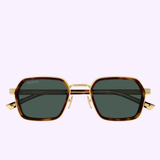 Gucci Sunglasses GG2074S-003 51 feature geometric tortoiseshell frames with gold accents and dark lenses, epitomizing contemporary luxury eyewear, showcased against a pale lavender background.