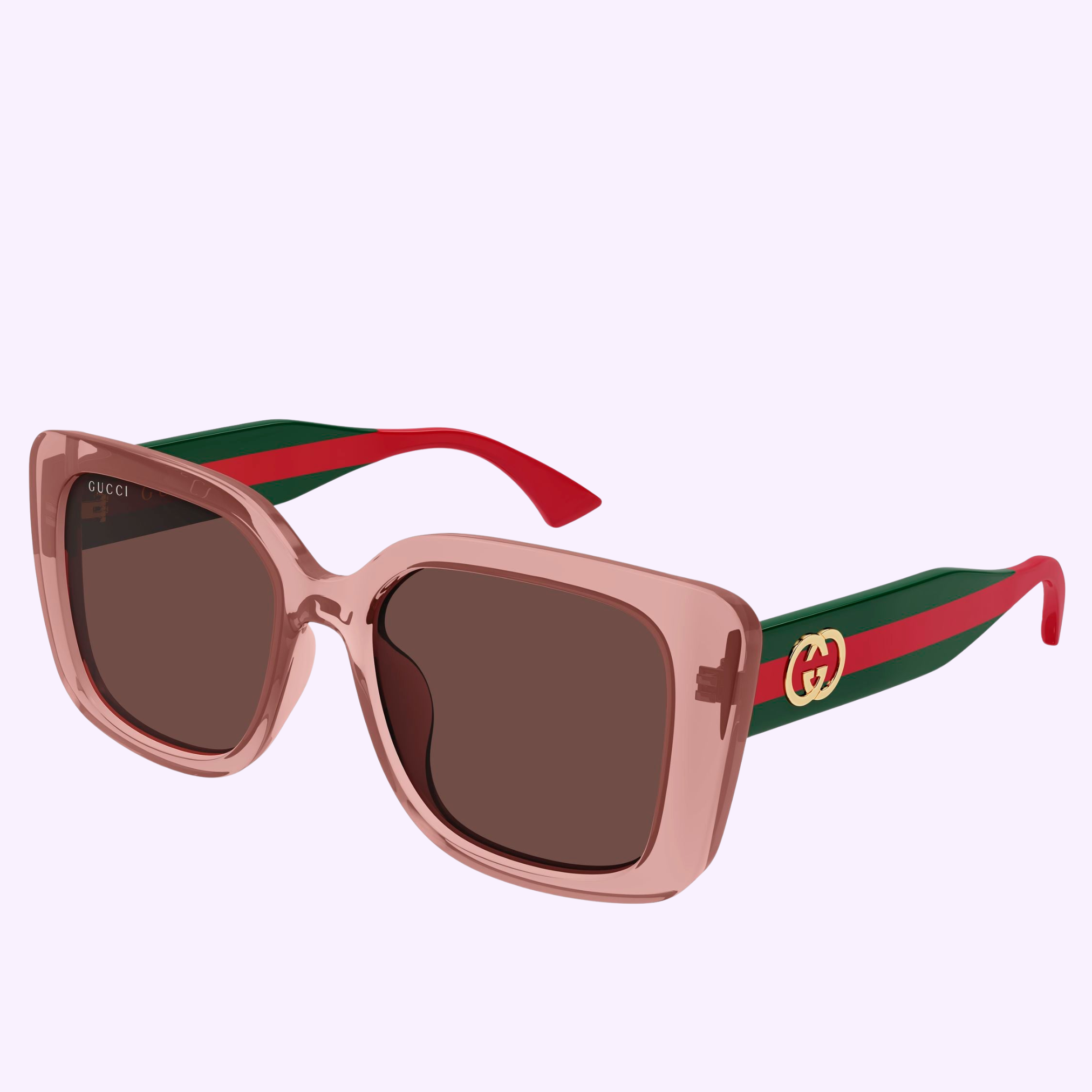 Gucci Sunglasses GG2118SA-003 55 feature square pink translucent frames, brown lenses, wide green arms with red stripes and gold logo, plus red-tipped arms. A luxury accessory from Gucci Sunglasses set against a light purple background.