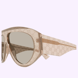 Gucci Sunglasses GG2128S-005 58, featuring a beige frame with a brown gradient lens and an all-over GG logo pattern on the frame and arms, are showcased against a light lavender background—an iconic accessory from Gucci Sunglasses for luxury fashion enthusiasts.