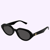 Gucci Sunglasses GG2178S-001 53 feature black oval frames with dark lenses, thick temples, and subtle gold logo accents, presented on a light background—an ideal choice for those who appreciate contemporary fashion and timeless style.